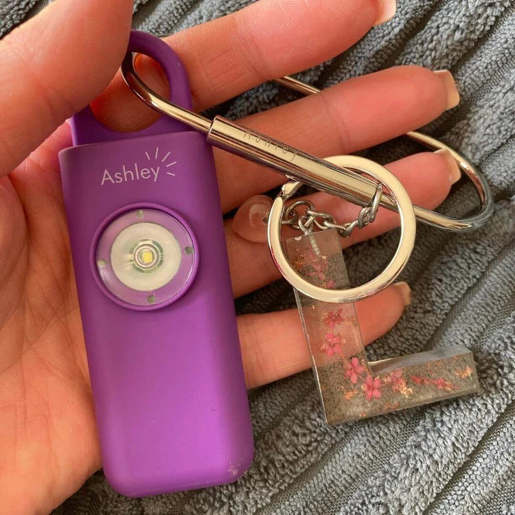 Ashley, your personal safety alarm, in purple